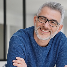 man smiling after getting all on 4 implants